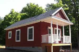 Mini red cabin with front porch
